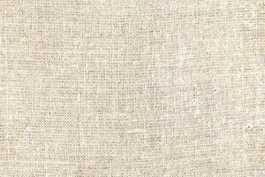Natural linen material textile canvas Fabric texture background Close-up detail of fabric natural color Hemp material pattern design wallpaper. can be used as background or for graphic design photo