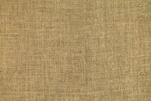 Natural linen material textile canvas Fabric texture background Close-up detail of fabric natural color Hemp material pattern design wallpaper. can be used as background or for graphic design photo