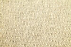 Natural linen material textile canvas Fabric texture background Close-up detail of fabric natural color Hemp material pattern design wallpaper. can be used as background or for graphic design photo
