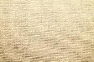 Natural linen material textile canvas Fabric texture background Close-up detail of fabric natural color Hemp material pattern design wallpaper. can be used as background or for graphic design photo
