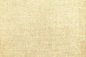 Natural linen material textile canvas Fabric texture background Close-up detail of fabric natural color Hemp material pattern design wallpaper. can be used as background or for graphic design photo