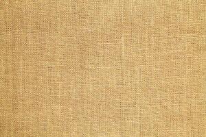Natural linen material textile canvas Fabric texture background Close-up detail of fabric natural color Hemp material pattern design wallpaper. can be used as background or for graphic design photo