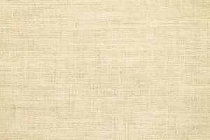 Natural linen material textile canvas Fabric texture background Close-up detail of fabric natural color Hemp material pattern design wallpaper. can be used as background or for graphic design photo