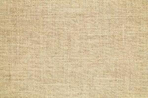 Natural linen material textile canvas Fabric texture background Close-up detail of fabric natural color Hemp material pattern design wallpaper. can be used as background or for graphic design photo