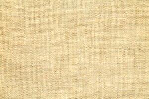 Natural linen material textile canvas Fabric texture background Close-up detail of fabric natural color Hemp material pattern design wallpaper. can be used as background or for graphic design photo