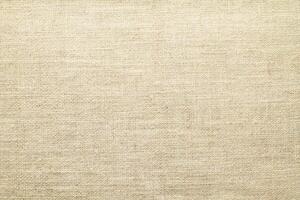 Natural linen material textile canvas Fabric texture background Close-up detail of fabric natural color Hemp material pattern design wallpaper. can be used as background or for graphic design photo
