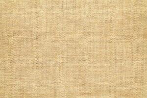 Natural linen material textile canvas Fabric texture background Close-up detail of fabric natural color Hemp material pattern design wallpaper. can be used as background or for graphic design photo