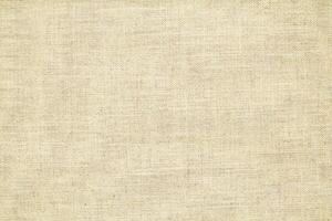 Natural linen material textile canvas Fabric texture background Close-up detail of fabric natural color Hemp material pattern design wallpaper. can be used as background or for graphic design photo