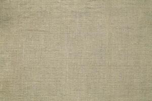 Natural linen material textile canvas Fabric texture background Close-up detail of fabric natural color Hemp material pattern design wallpaper. can be used as background or for graphic design photo