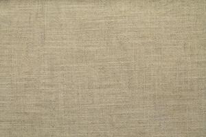 Natural linen material textile canvas Fabric texture background Close-up detail of fabric natural color Hemp material pattern design wallpaper. can be used as background or for graphic design photo