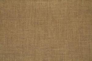 Natural linen material textile canvas Fabric texture background Close-up detail of fabric natural color Hemp material pattern design wallpaper. can be used as background or for graphic design photo