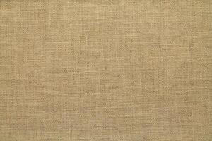 Natural linen material textile canvas Fabric texture background Close-up detail of fabric natural color Hemp material pattern design wallpaper. can be used as background or for graphic design photo