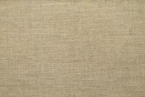 Natural linen material textile canvas Fabric texture background Close-up detail of fabric natural color Hemp material pattern design wallpaper. can be used as background or for graphic design photo
