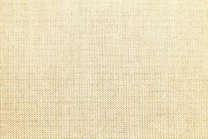 Natural linen material textile canvas Fabric texture background Close-up detail of fabric natural color Hemp material pattern design wallpaper. can be used as background or for graphic design photo