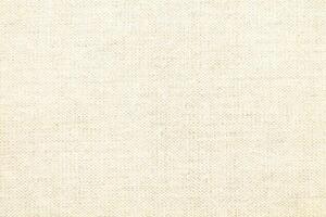 Natural linen material textile canvas Fabric texture background Close-up detail of fabric natural color Hemp material pattern design wallpaper. can be used as background or for graphic design photo