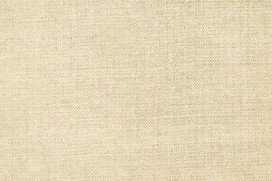 Natural linen material textile canvas Fabric texture background Close-up detail of fabric natural color Hemp material pattern design wallpaper. can be used as background or for graphic design photo