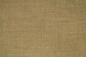 Natural linen material textile canvas Fabric texture background Close-up detail of fabric natural color Hemp material pattern design wallpaper. can be used as background or for graphic design photo