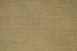 Natural linen material textile canvas Fabric texture background Close-up detail of fabric natural color Hemp material pattern design wallpaper. can be used as background or for graphic design photo