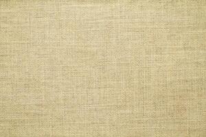 Natural linen material textile canvas Fabric texture background Close-up detail of fabric natural color Hemp material pattern design wallpaper. can be used as background or for graphic design photo