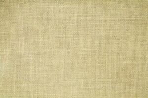 Natural linen material textile canvas Fabric texture background Close-up detail of fabric natural color Hemp material pattern design wallpaper. can be used as background or for graphic design photo
