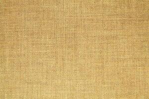 Natural linen material textile canvas Fabric texture background Close-up detail of fabric natural color Hemp material pattern design wallpaper. can be used as background or for graphic design photo