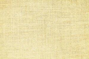 Natural linen material textile canvas Fabric texture background Close-up detail of fabric natural color Hemp material pattern design wallpaper. can be used as background or for graphic design photo