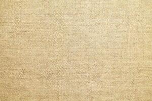 Natural linen material textile canvas Fabric texture background Close-up detail of fabric natural color Hemp material pattern design wallpaper. can be used as background or for graphic design photo