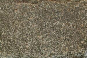 Abstract natural rock stone granite grunge rusty metal texture design background natural color stone material granite design wallpaper. Close-up detail of natural stone photo
