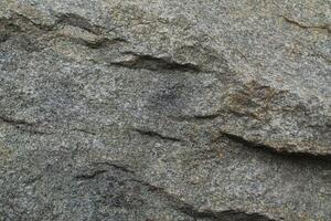 Abstract natural rock stone granite grunge rusty metal texture design background natural color stone material granite design wallpaper. Close-up detail of natural stone photo