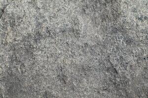Abstract natural rock stone granite grunge rusty metal texture design background natural color stone material granite design wallpaper. Close-up detail of natural stone photo