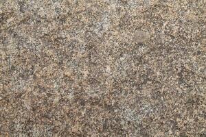 Abstract natural rock stone granite grunge rusty metal texture design background natural color stone material granite design wallpaper. Close-up detail of natural stone photo