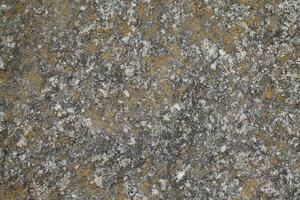 Abstract natural rock stone granite grunge rusty metal texture design background natural color stone material granite design wallpaper. Close-up detail of natural stone photo