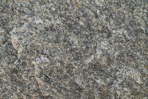 Abstract natural rock stone granite grunge rusty metal texture design background natural color stone material granite design wallpaper. Close-up detail of natural stone photo