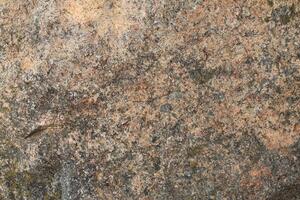 Abstract natural rock stone granite grunge rusty metal texture design background natural color stone material granite design wallpaper. Close-up detail of natural stone photo