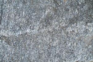 Abstract natural rock stone granite grunge rusty metal texture design background natural color stone material granite design wallpaper. Close-up detail of natural stone photo