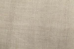 Natural linen material textile canvas Fabric texture background Close-up detail of fabric natural color Hemp material pattern design wallpaper. can be used as background or for graphic design photo