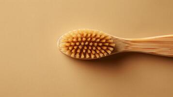 A photo of a bamboo toothbrush on a beige background. Zero waste.