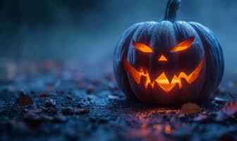 A carved pumpkin with a sinister grin glowing in the dark, leaving space on the left for text photo
