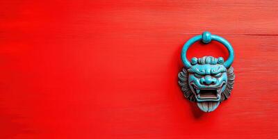 Blue lion door knocker on a red wooden door. Traditional oriental design element for Chinese style architecture and decoration. photo