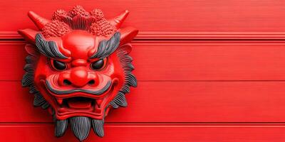 Close-up of red Chinese dragon face sculpture on wooden background. Symbol of strength, power, and tradition. Vibrant, cultural, and artistic. photo