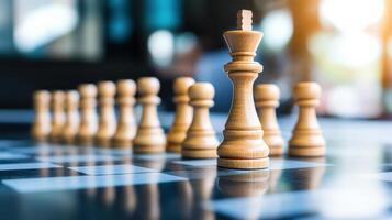 Close up of a chessboard with wooden chess pieces arranged, highlighting the king and the pawns, symbolizing strategy and leadership. photo