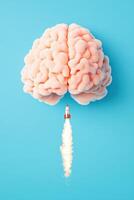 Creative concept image of a brain with a rocket launching from it, symbolizing innovation, ideas, and intelligence on a blue background. photo
