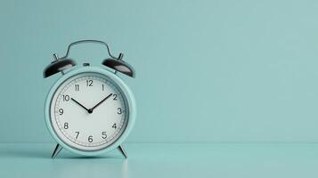Stylish alarm clock with a mint green background, perfect for representing time management and productivity themes. photo