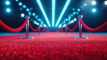 A stunning red carpet pathway, lined with elegant ropes and illuminated by dramatic blue lights, perfect for glamorous events. photo