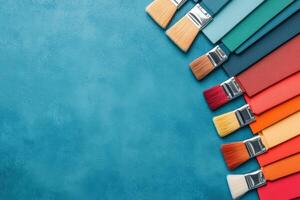 A vibrant array of paintbrushes with colorful bristles arranged on a blue background, perfect for artistic themes. photo
