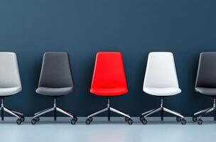 A modern lineup of stylish office chairs in various colors against a minimalist wall, ideal for contemporary workspace designs. photo