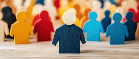 Colorful wooden figures standing together, symbolizing diversity, teamwork, and community engagement in a creative setting. photo
