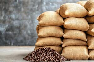 A stack of burlap sacks filled with fresh coffee beans on a textured background, ideal for food and beverage themes. photo
