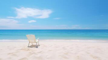 White chair on a beautiful tropical beach with a clear blue sky and ocean. photo