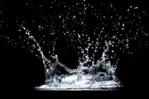 High-Speed Capture of Water Splash Against Black Background in Studio Lighting photo